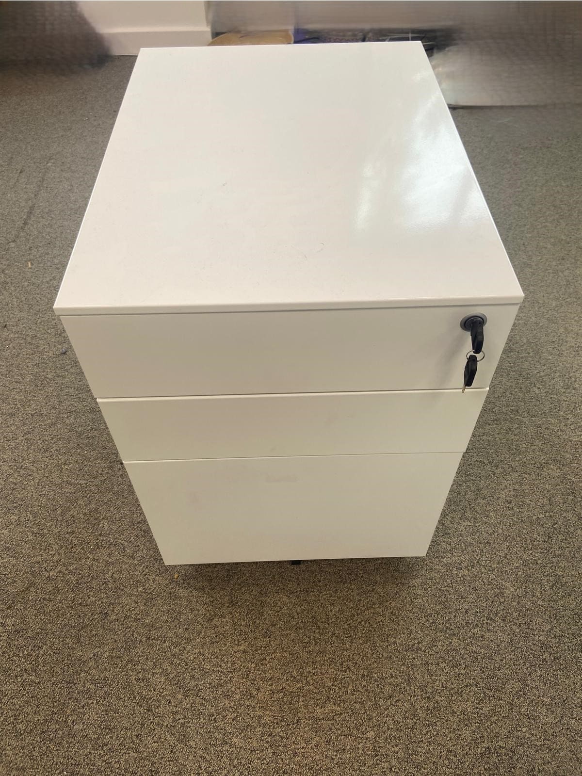 White Metal Desk Under Pedestal